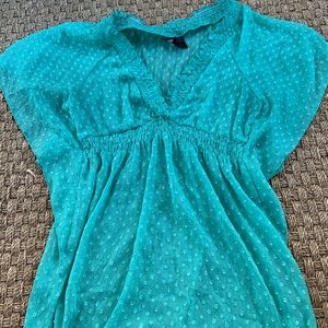 See through light green/teal shirt
